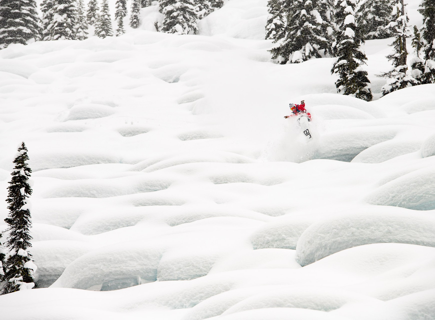 Private heli skiing trip at Stellar Heliskiing riding legendary pillow lines.