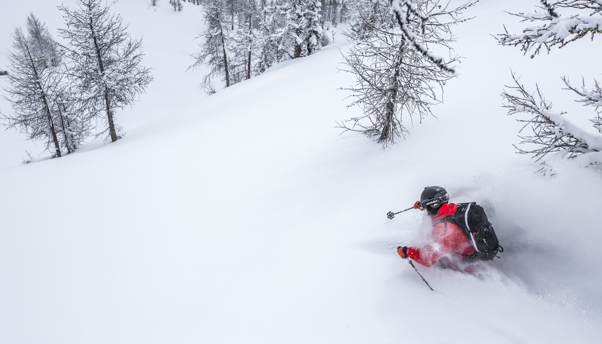 Powder skiing through trees in British Columbia, Canada.