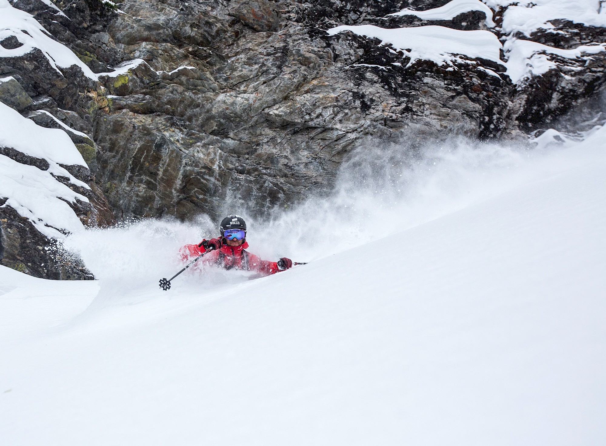 Guest powder skiing on a private heli ski trip to Stellar Heliskiing, BC, Canada.